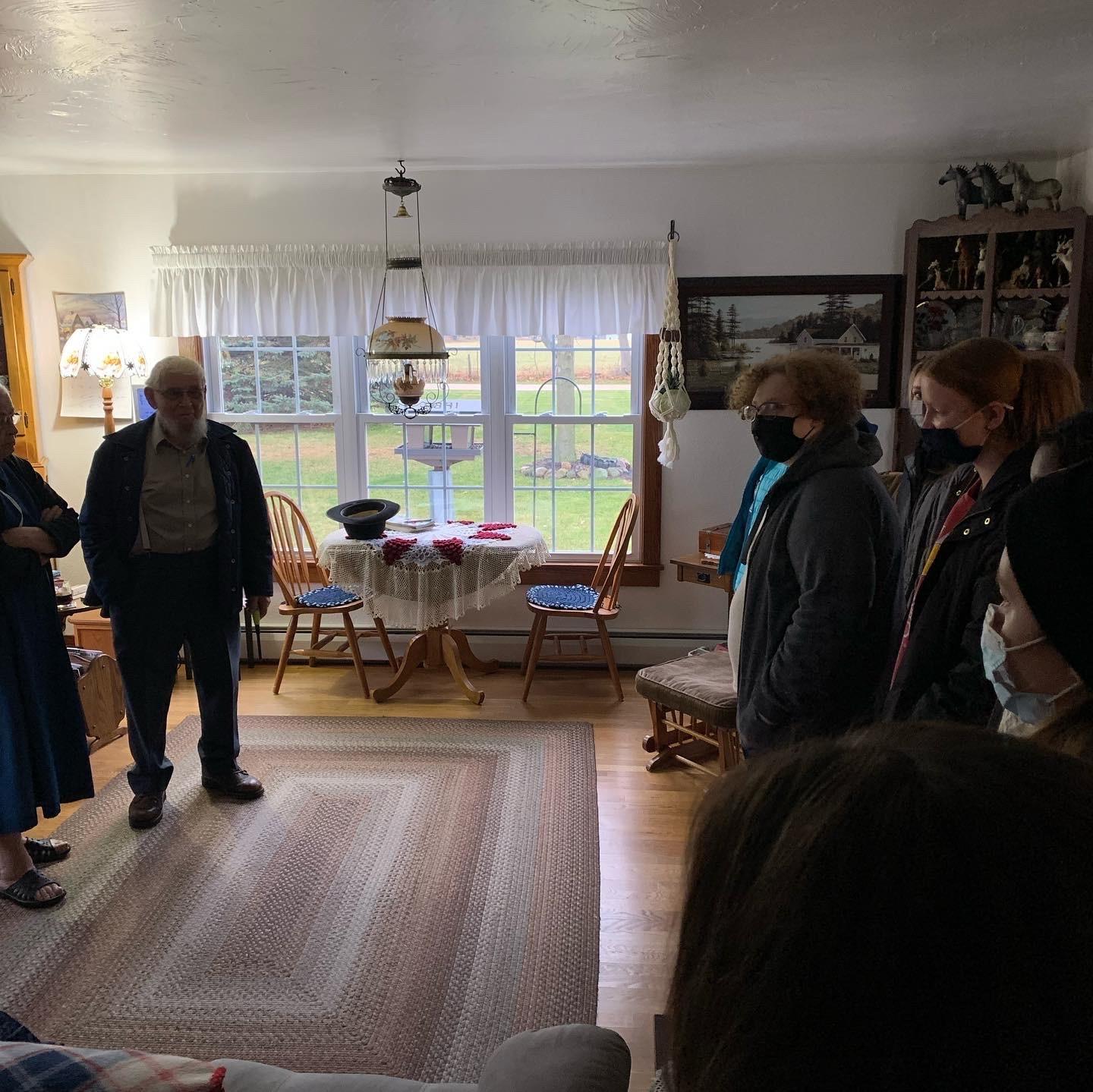 students and teachers in a house