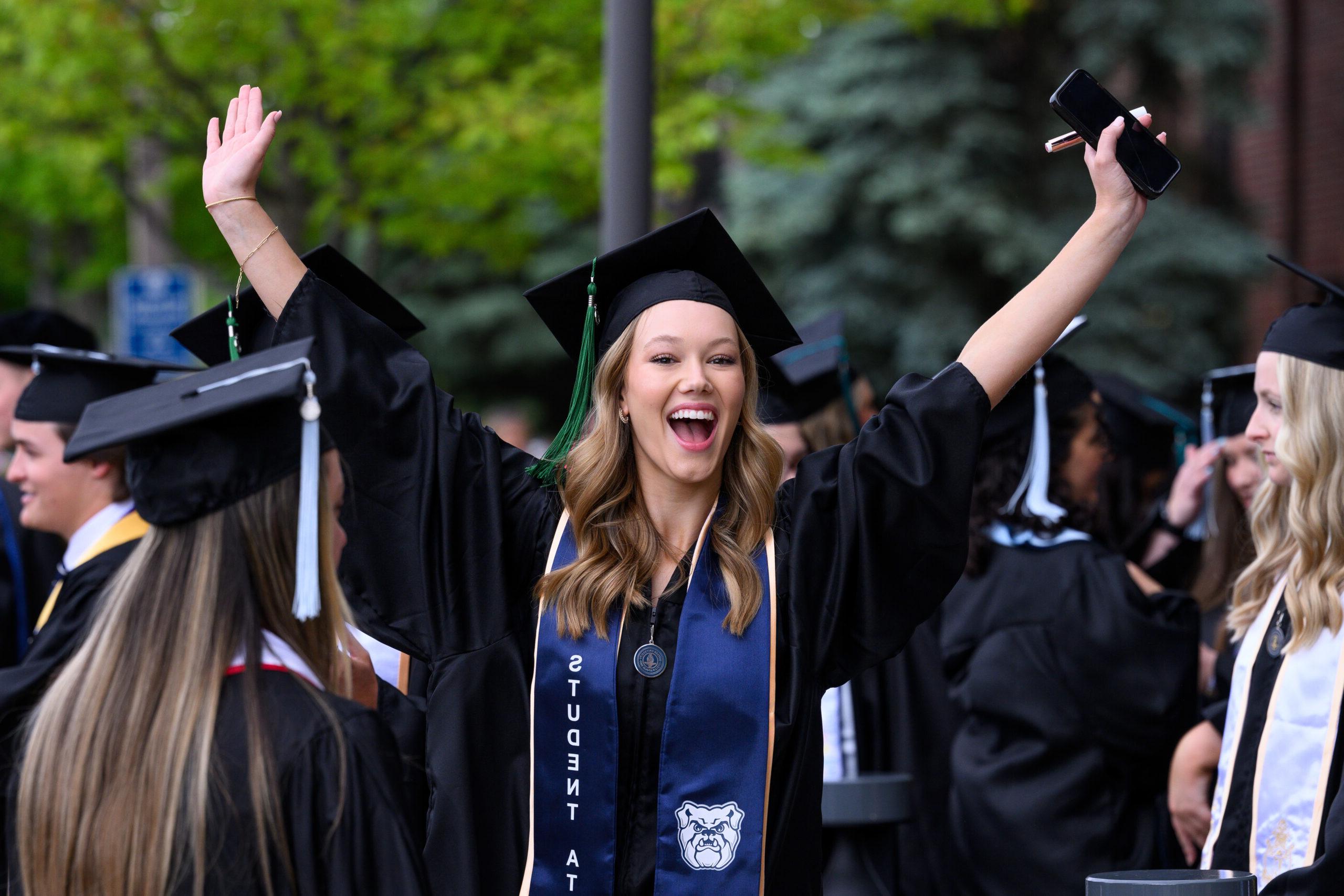 Female 皇冠投注 graduate excited at Commencement ceremony.